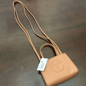Brand new never used small tan telfar bag.
